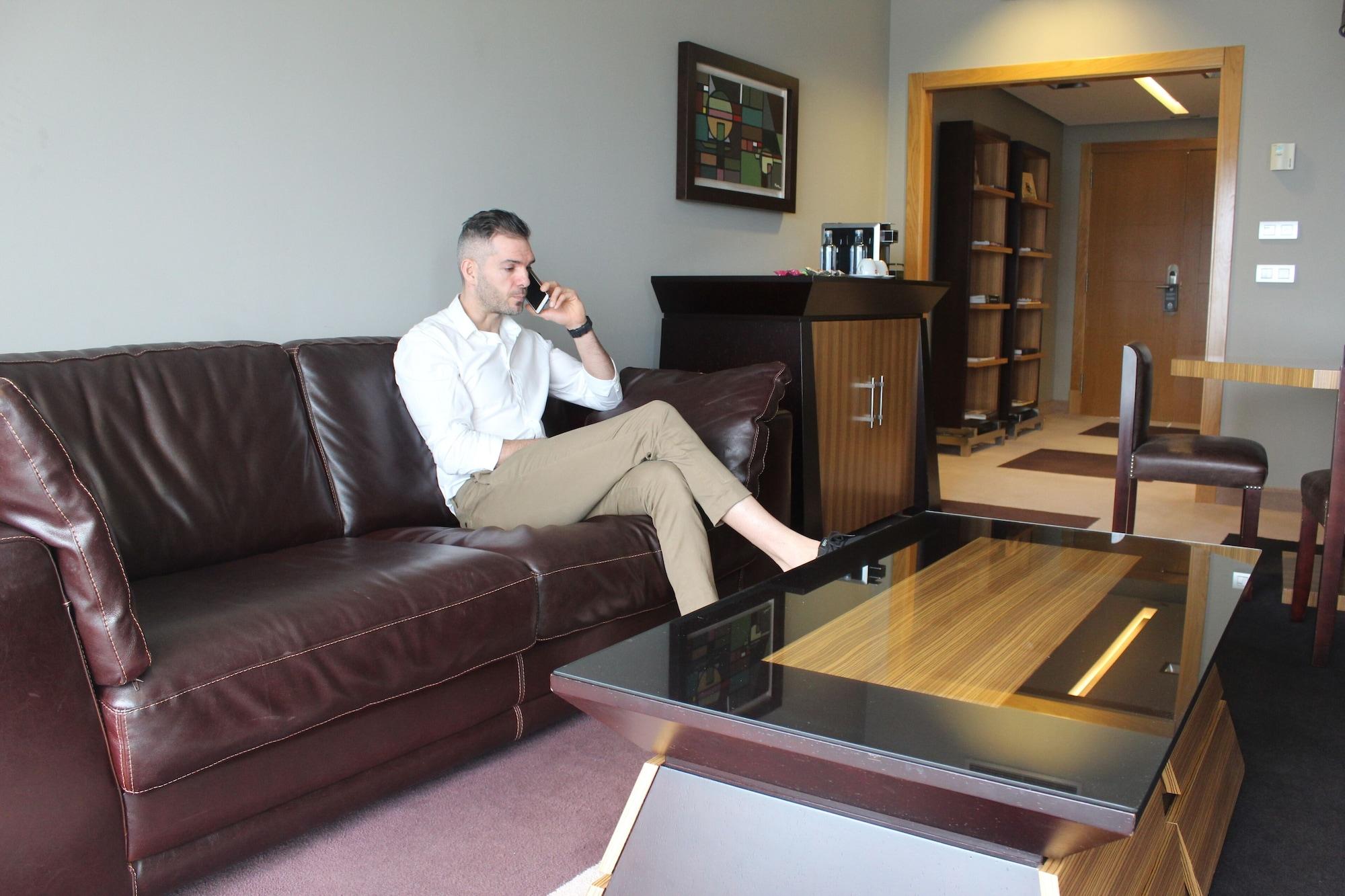 Pazo Los Escudos Hotel Spa & Resort Vigo Exterior photo A man sitting on a sofa